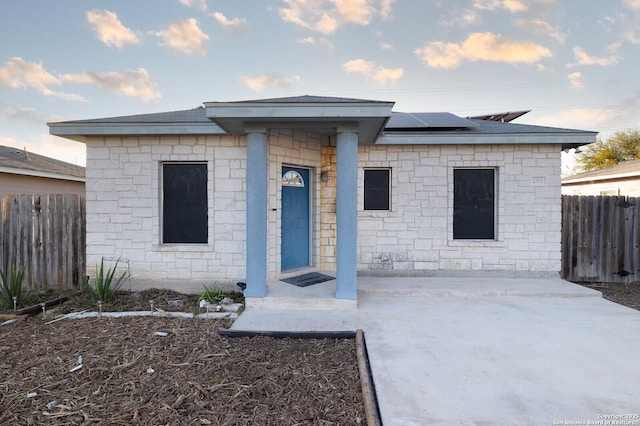 view of front of house with solar panels