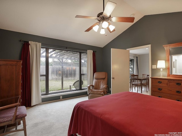 bedroom featuring vaulted ceiling, light colored carpet, and ceiling fan