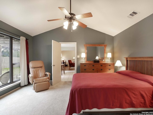 carpeted bedroom with ceiling fan and lofted ceiling