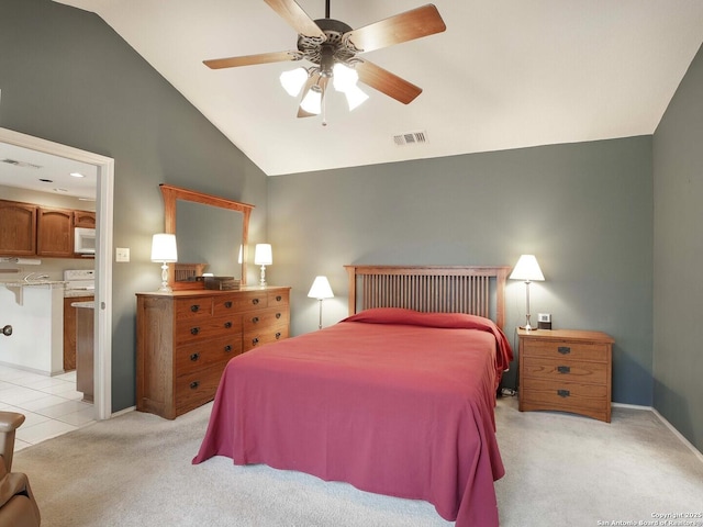 carpeted bedroom with vaulted ceiling and ceiling fan