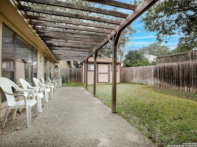 view of patio with a storage shed and a pergola