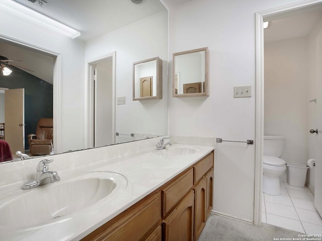 bathroom with vanity, ceiling fan, tile patterned floors, and toilet