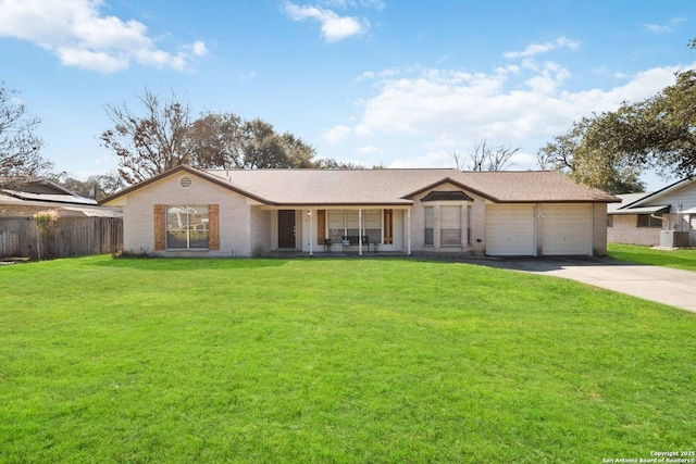 ranch-style house with a garage and a front lawn