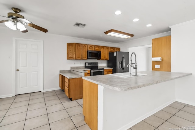 kitchen with light tile patterned flooring, sink, crown molding, kitchen peninsula, and black appliances