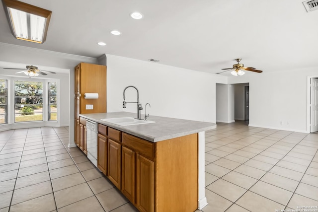 kitchen featuring light tile patterned flooring, ceiling fan, dishwasher, and sink