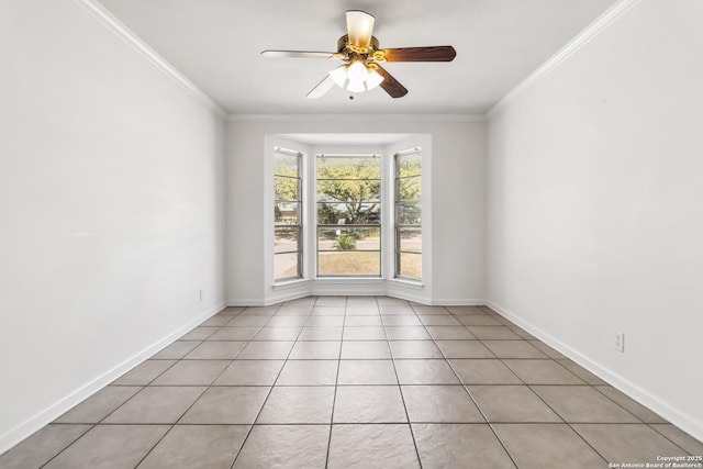 empty room featuring crown molding, ceiling fan, and light tile patterned floors