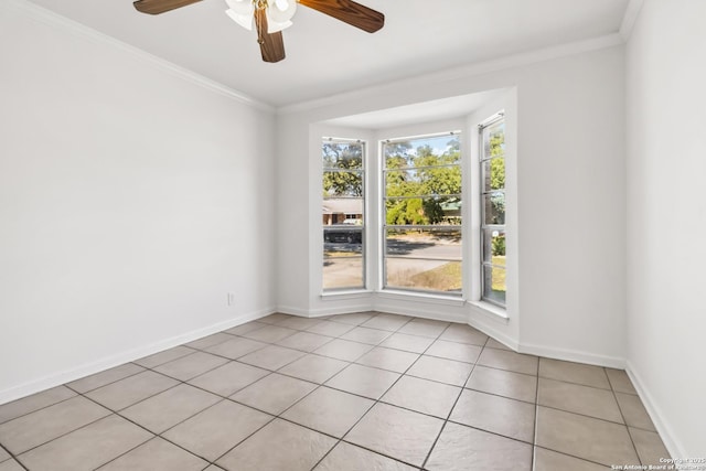 empty room with crown molding, light tile patterned flooring, and ceiling fan