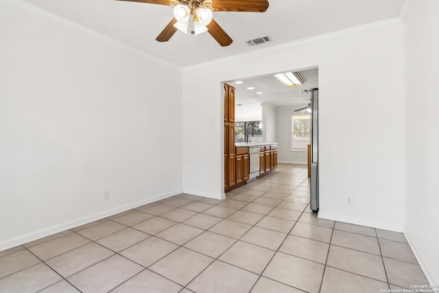 tiled empty room featuring sink, crown molding, and ceiling fan