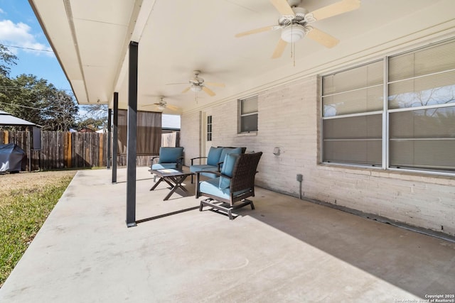 view of patio / terrace with area for grilling and ceiling fan