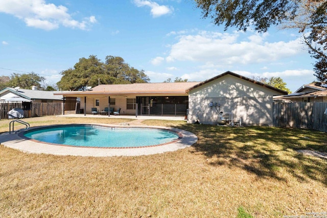 view of pool featuring a patio and a lawn