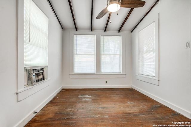 empty room with beamed ceiling, ceiling fan, dark hardwood / wood-style floors, and cooling unit