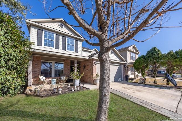 view of front of property with a garage, covered porch, and a front yard