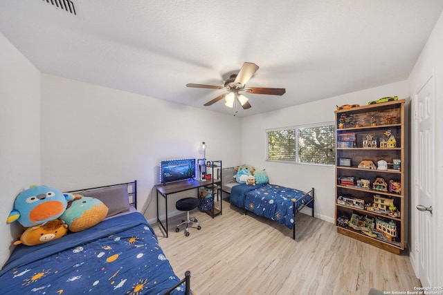 bedroom featuring ceiling fan and light hardwood / wood-style floors