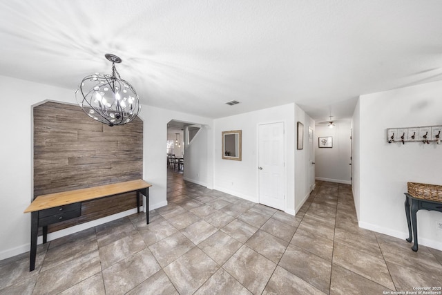 dining room featuring tile patterned floors and a chandelier