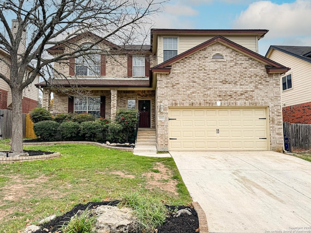 view of property with a garage and a front yard