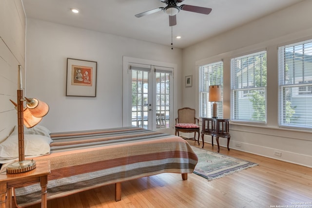 bedroom with light hardwood / wood-style flooring, french doors, and access to outside