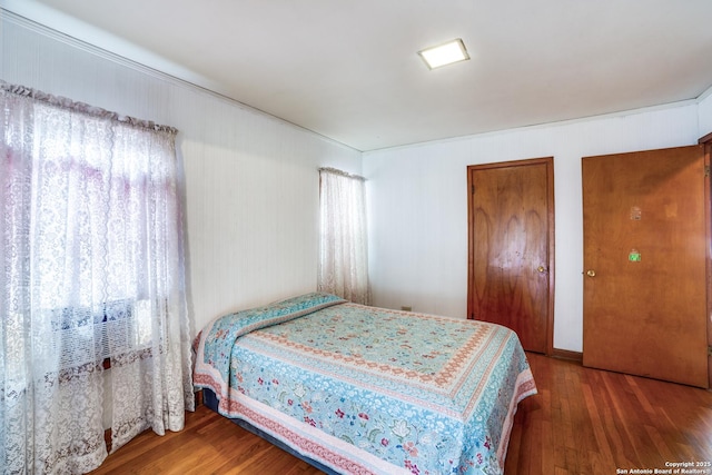 bedroom with wood finished floors