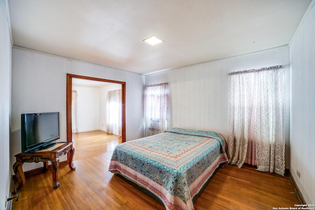 bedroom featuring wood finished floors