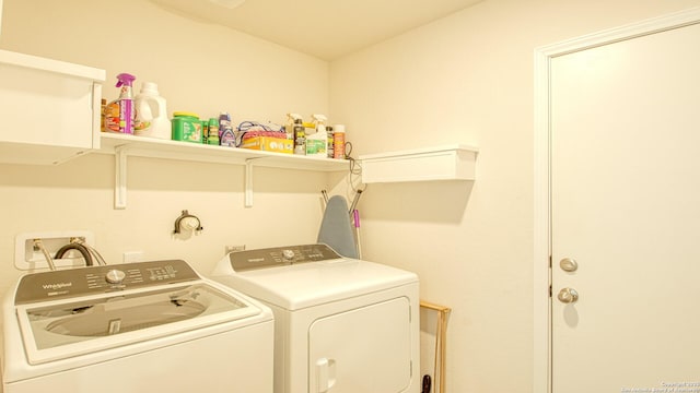 washroom with independent washer and dryer