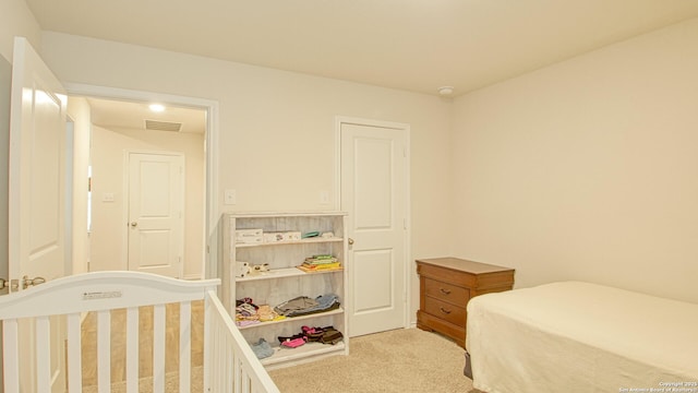 bedroom with light carpet