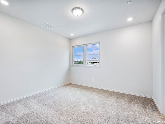 unfurnished room with carpet flooring