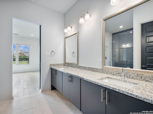 bathroom featuring walk in shower and vanity