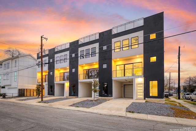 outdoor building at dusk with a garage