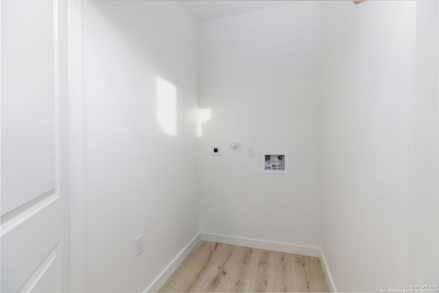 washroom with washer hookup, hookup for an electric dryer, and light wood-type flooring