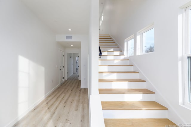 staircase featuring hardwood / wood-style floors