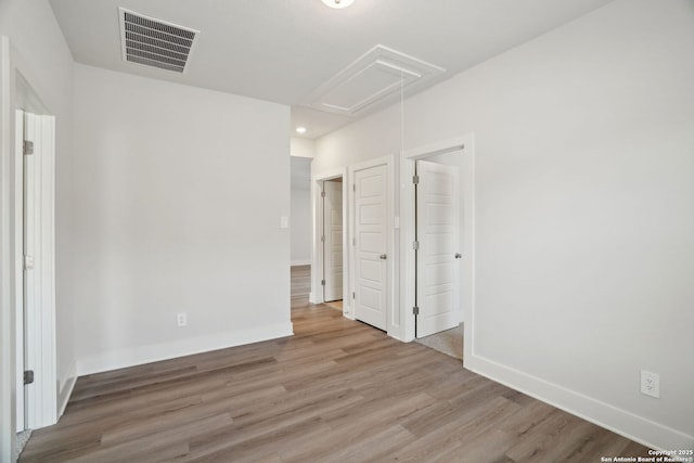 14527 Rainwater Trl, San Antonio, TX 78253 - unfurnished bedroom with attic access, wood finished floors, and baseboards