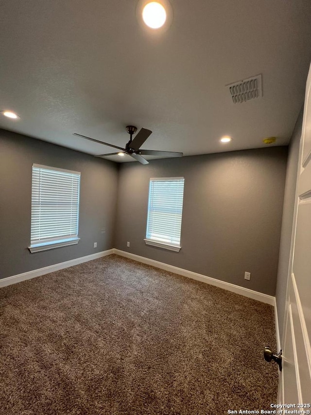 carpeted empty room with ceiling fan