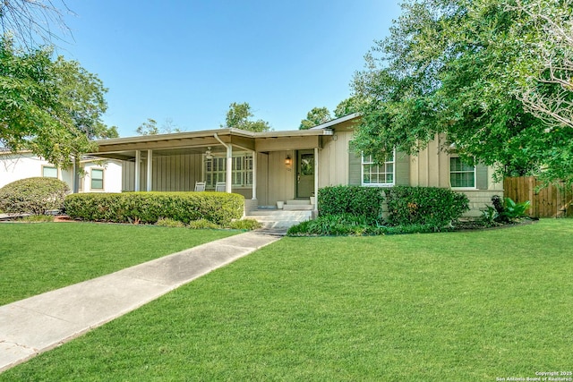 ranch-style home featuring a front yard