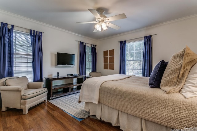 bedroom featuring ornamental molding, dark hardwood / wood-style floors, and ceiling fan