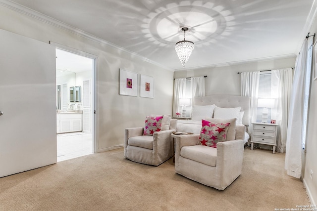 bedroom featuring crown molding, light colored carpet, an inviting chandelier, and ensuite bath