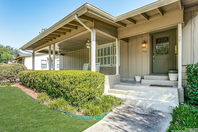 view of exterior entry featuring ceiling fan