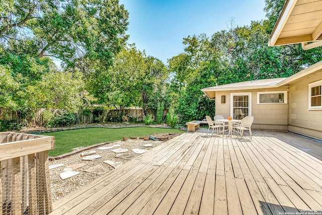 wooden deck with a yard