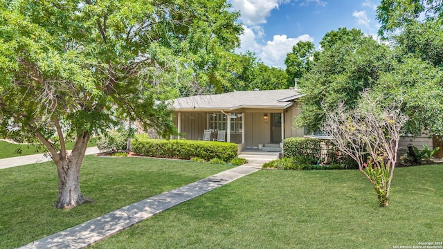 view of front of property with a porch and a front yard