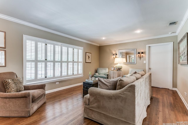 living room with wood-type flooring and ornamental molding