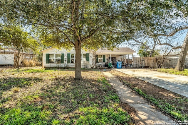 view of front facade with a carport