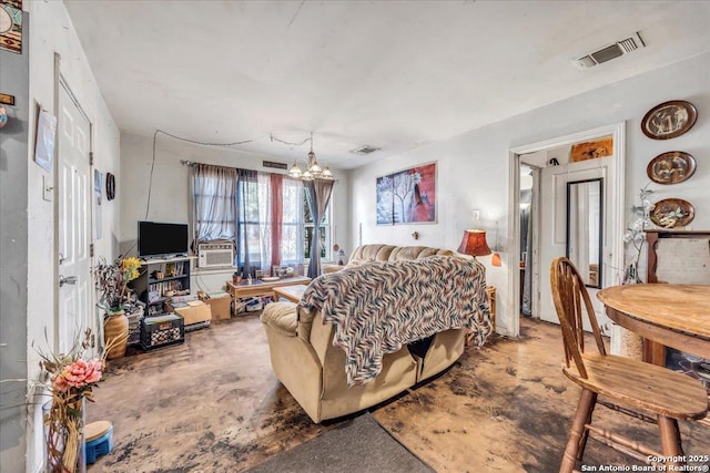 bedroom featuring cooling unit, concrete floors, and a notable chandelier