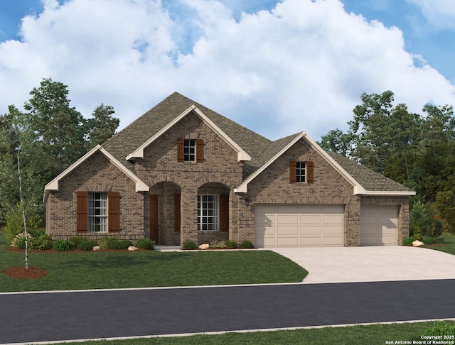 view of front of house with a garage and a front yard