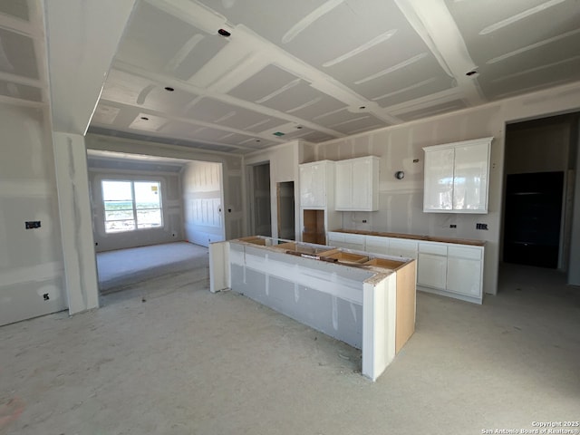 kitchen featuring white cabinetry and a center island