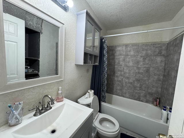 full bathroom with vanity, shower / tub combo with curtain, a textured ceiling, and toilet