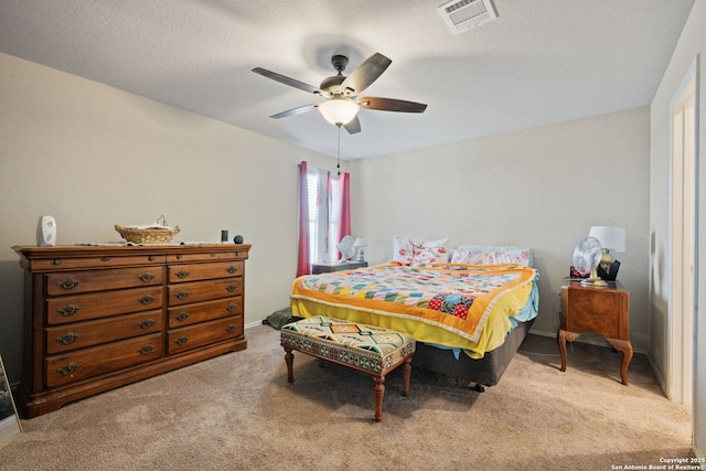 439 Agave Cir, Jourdanton, TX 78026 - bedroom with light carpet and ceiling fan