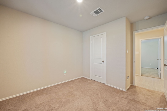 439 Agave Cir, Jourdanton, TX 78026 - empty room featuring light carpet