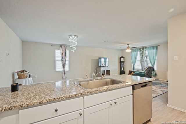 439 Agave Cir, Jourdanton, TX 78026 - kitchen featuring white cabinetry, dishwasher, plenty of natural light, and sink