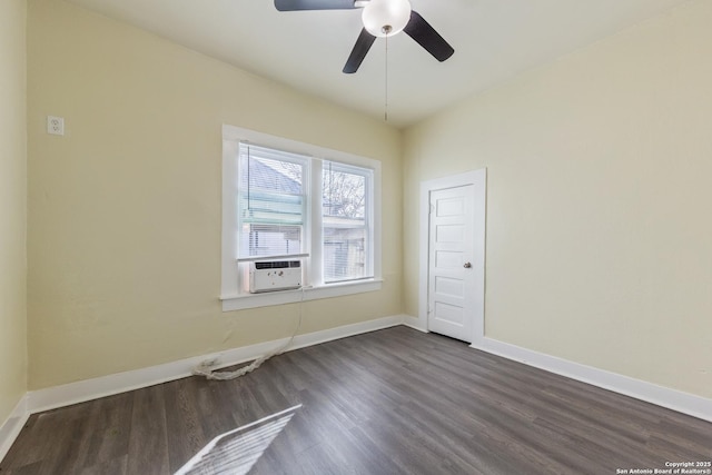 spare room with cooling unit, ceiling fan, and dark hardwood / wood-style floors