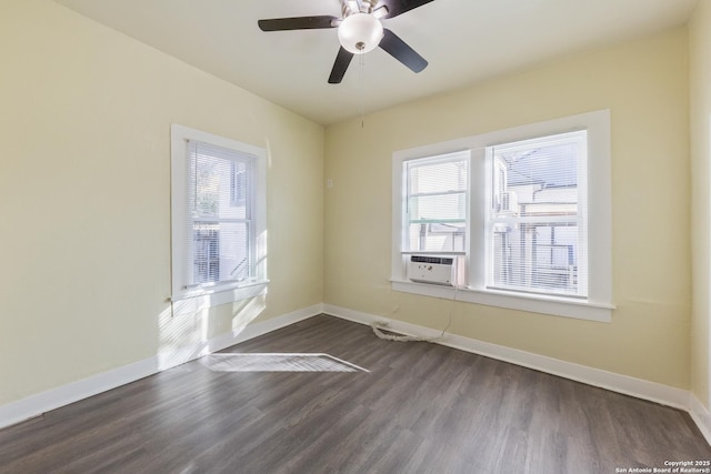 empty room featuring cooling unit, hardwood / wood-style flooring, and ceiling fan