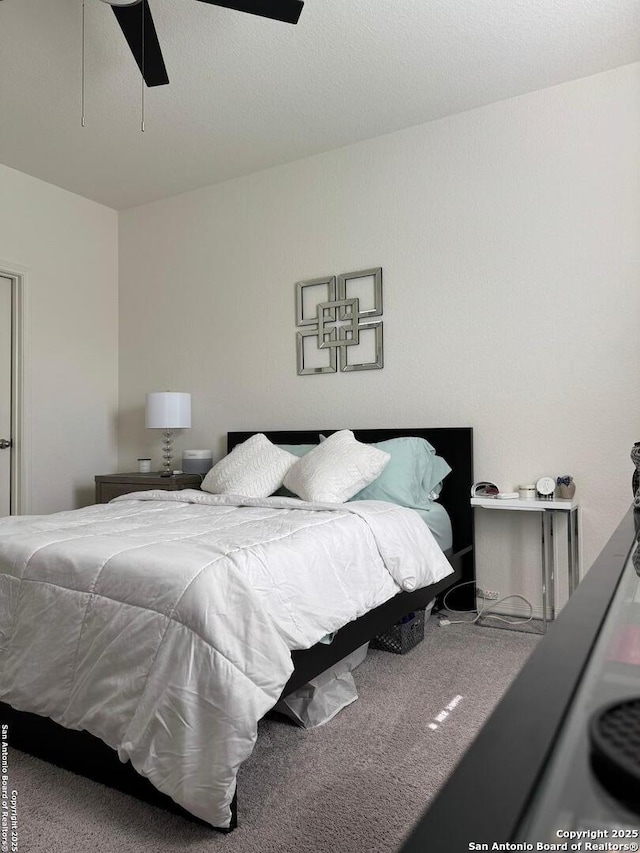 bedroom featuring ceiling fan and carpet floors