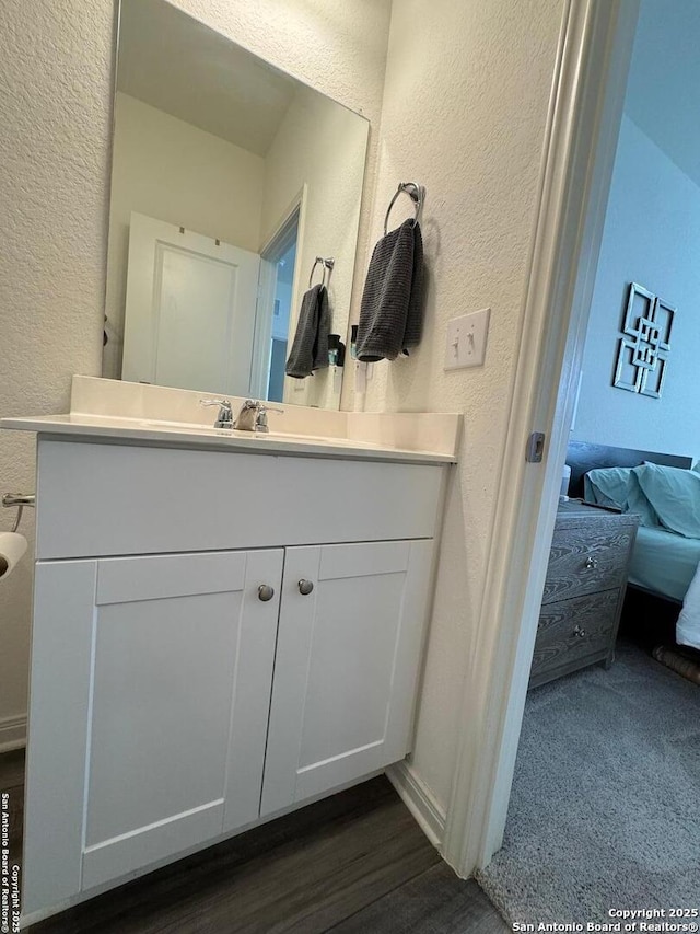 bathroom featuring vanity and hardwood / wood-style floors